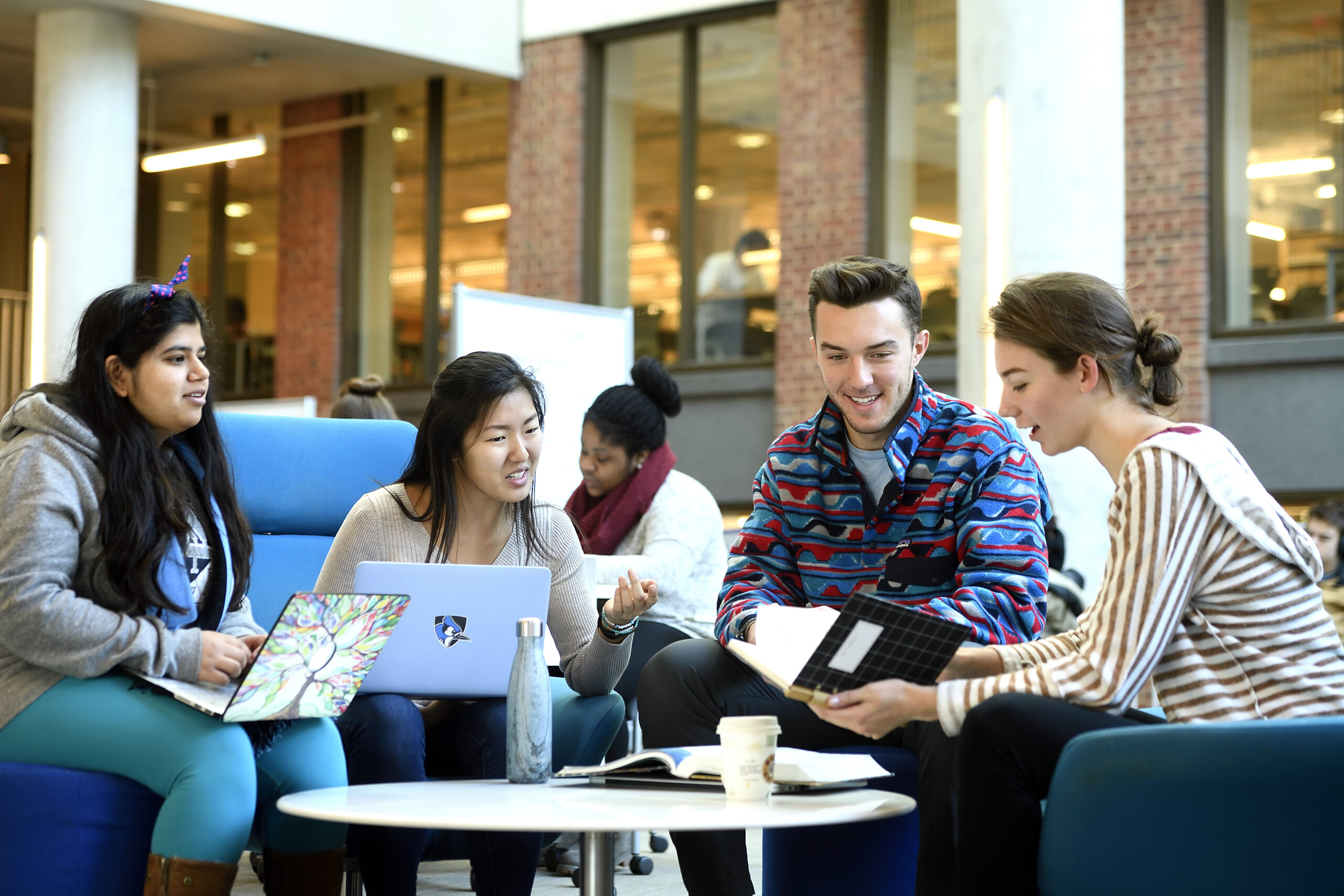 A group of students collaborating in a study area