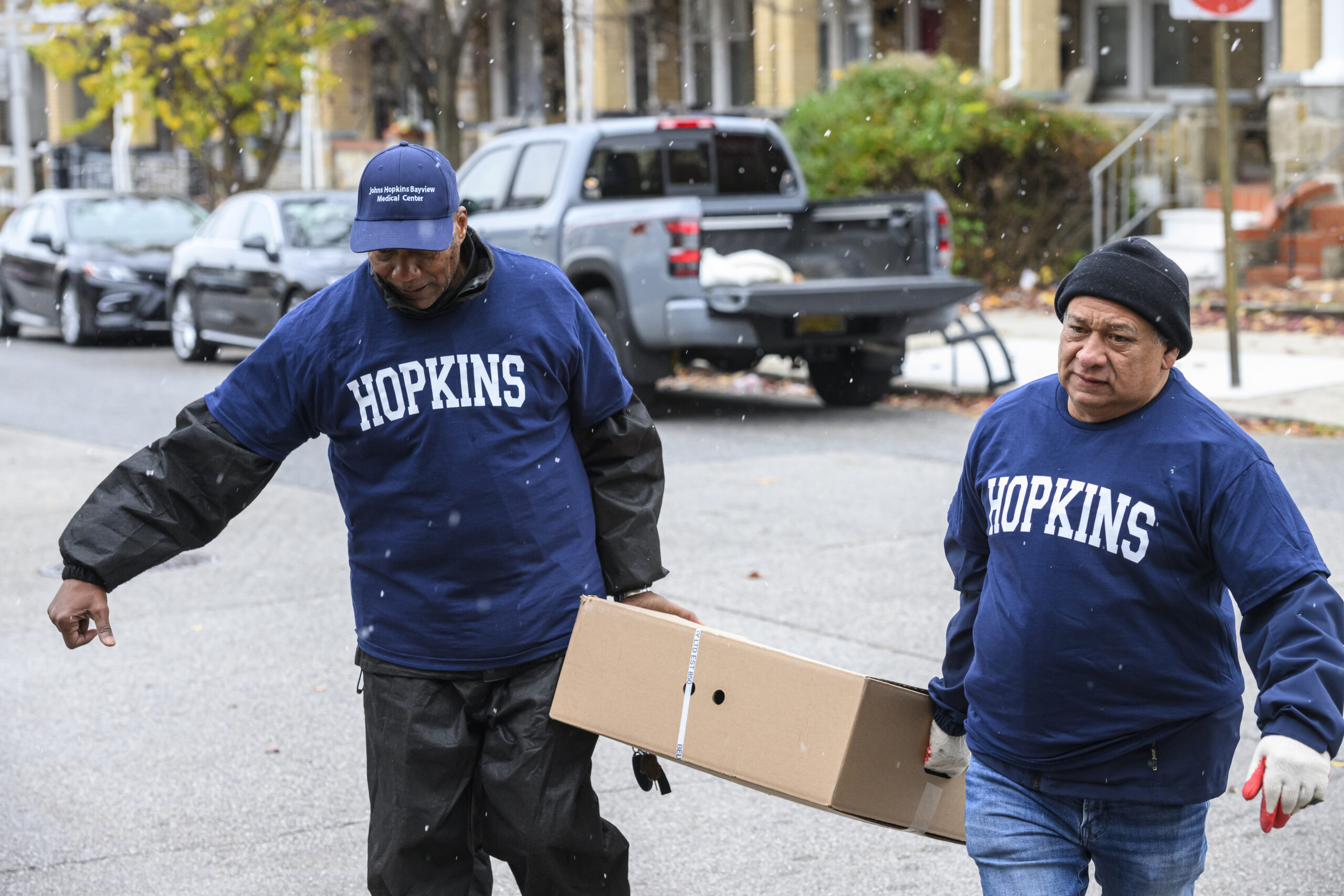Community members participating in a neighborhood cleanup event