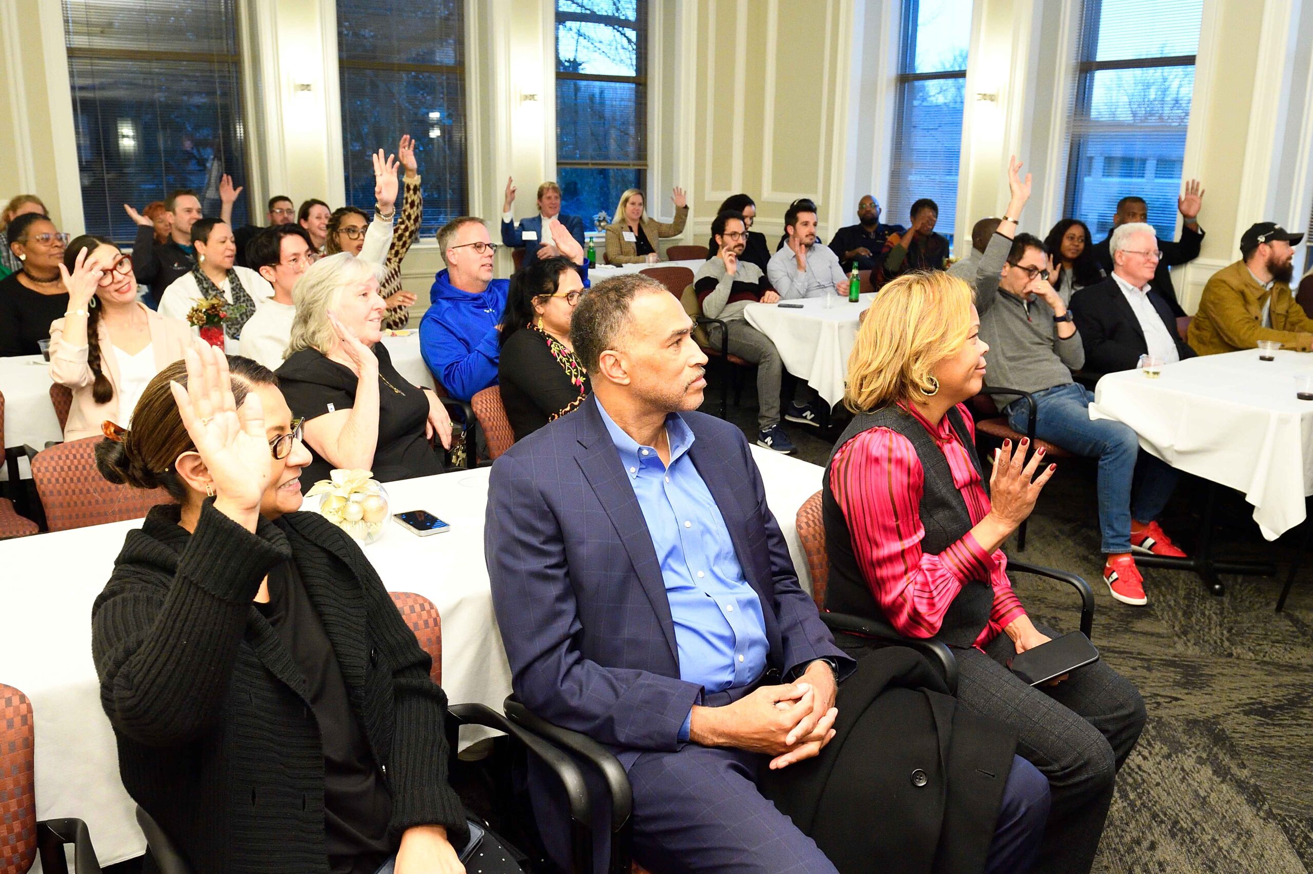 Room filled with people engaged in an interactive group session