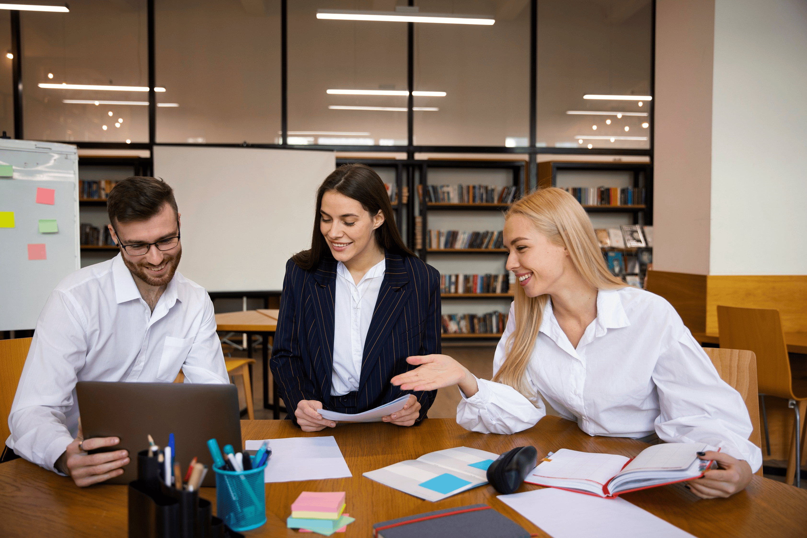 Office meeting with intern presenting ideas to coworkers